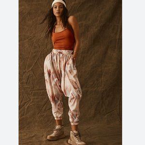 NWOT Free People Movement All Strapped One Piece Harem Jumpsuit in Orange